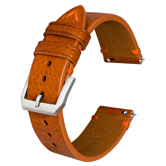 Side-stitched strap in brown vegetable-tanned leather with orange stitching